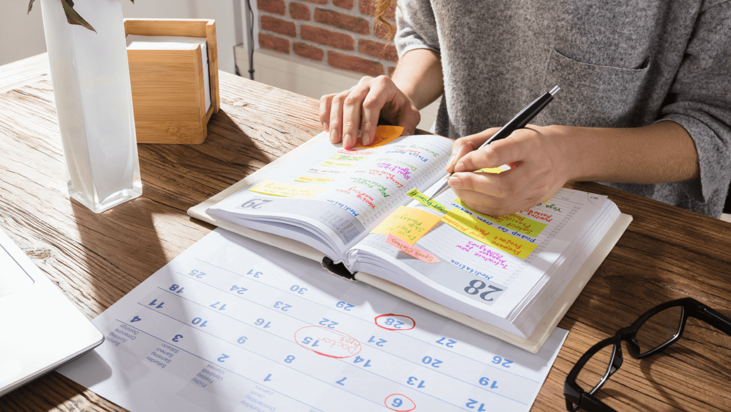 Photo of person managing a calendar